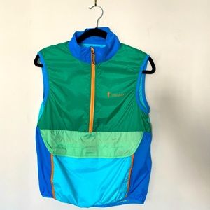 Bright color block Cotopaxi half-zip vest with front pocket